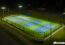 Terrains de pickleball éclairés de nuit vus du ciel